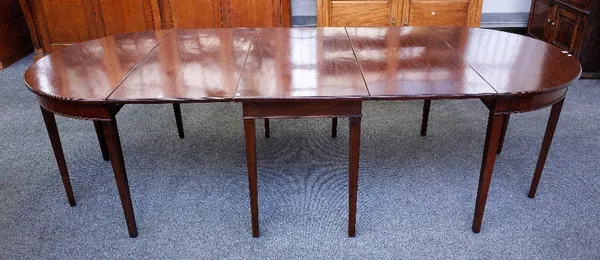 A George III mahogany triple section D-end extending dining table on tapering square supports, two extra leaves, 111cm wide x 165cm high, 267cm fully