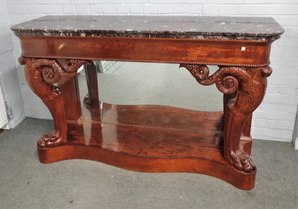 A 19th century French console, the marble D-shaped top on a pair of scroll capped mahogany lion leg supports, on serpentine base, united by mirror bac