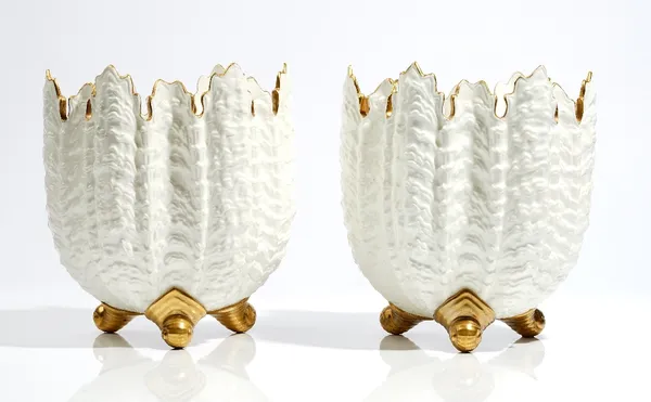 A pair of Coalport white and gilt bone china shell moulded jardinieres, late 19th century, green printed mark, pattern A 7048, 21cm. high, (2).