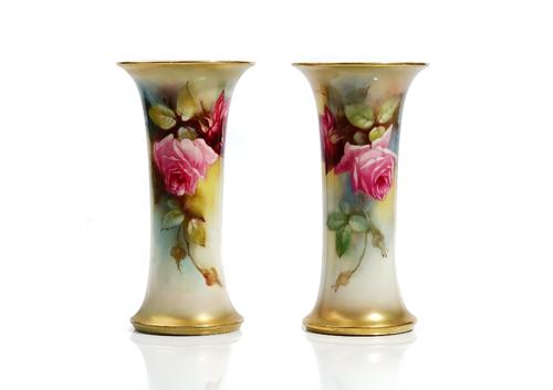 A pair of Royal Worcester beaker vases, circa 1912, each painted with pink roses, one by K.Blake, the other by M.Hunt, green printed marks, 19.5cm. hi