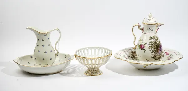 An Amstel porcelain jug and oval basin, circa 1800, painted with blue cornflowers inside gilt rims, blue painted Amstel mark, incised M:O:L. L.I *,  j