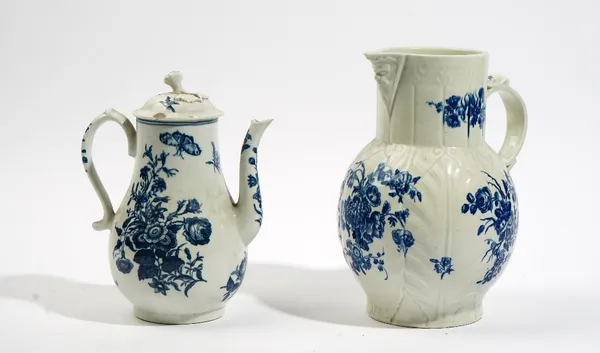 A Worcester blue and white cabbage leaf moulded mask jug, circa 1770, printed with `The Bouquets' pattern, blue hatched crescent mark, 24cm. high; and