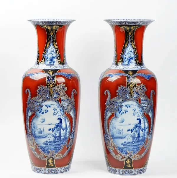 A pair of tall Kaiser porcelain vases, second half 20th century, each decorated with the `Siam' pattern, blue and red printed marks, 67.5cm. high, (2)