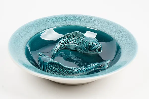 A Poole Pottery blue glazed carp carp dish by Alan White, impressed marks, 214/250, 32.5cm. diameter.