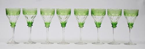 A set of twelve green stained hock glasses, probably John Walsh Walsh, 1930s, each acid etched with fruiting vine, unmarked, 19.75cm. high, (12)