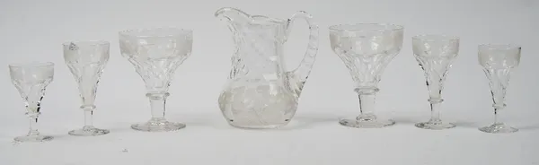 A part suite of John Walsh Walsh table glass, circa 1935, each piece acid etched with fruiting vine, comprising; a jug, 17cm. high, eleven pan topped