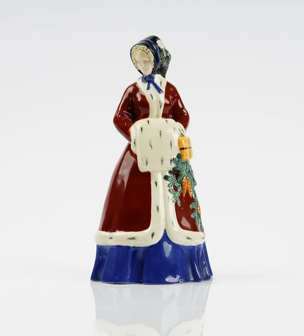 An Austrian earthenware figure of a girl representing Winter, after a model by Johanna Meir-Michel, modelled standing with a muff, impressed 1373/ 282