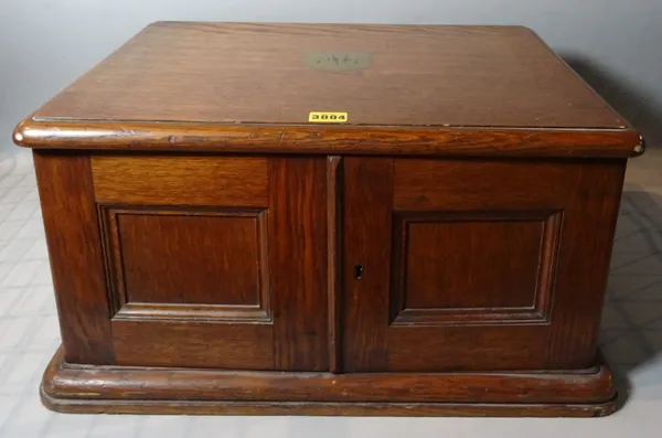 An early 20th century oak canteen of silver plated cutlery, 51cm wide x 28cm high.