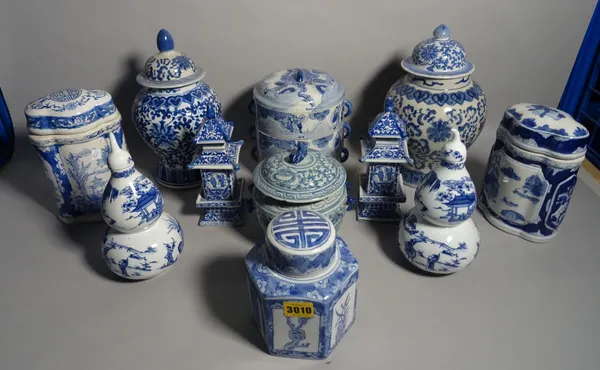 Modern Asian ceramics, including; a pair of vases and covers in the form of pagodas, a pair of double gourd shaped vases and seven further modern blue