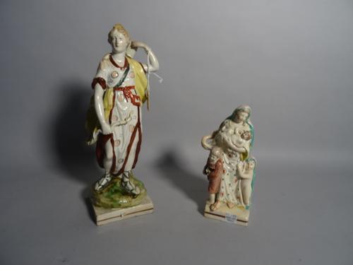 A Staffordshire pearlware figure of Diana the huntress, circa 1800, standing with her bow and quiver of arrows, square base, 29.5cm. high; also a Staf