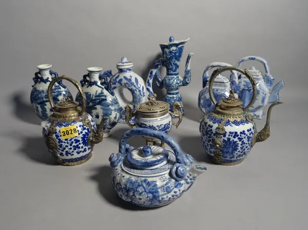 Asian ceramics including a pair of modern white metal mounted blue and white tea pots, a similar sugar bowl, a pair of moon flasks and five further te