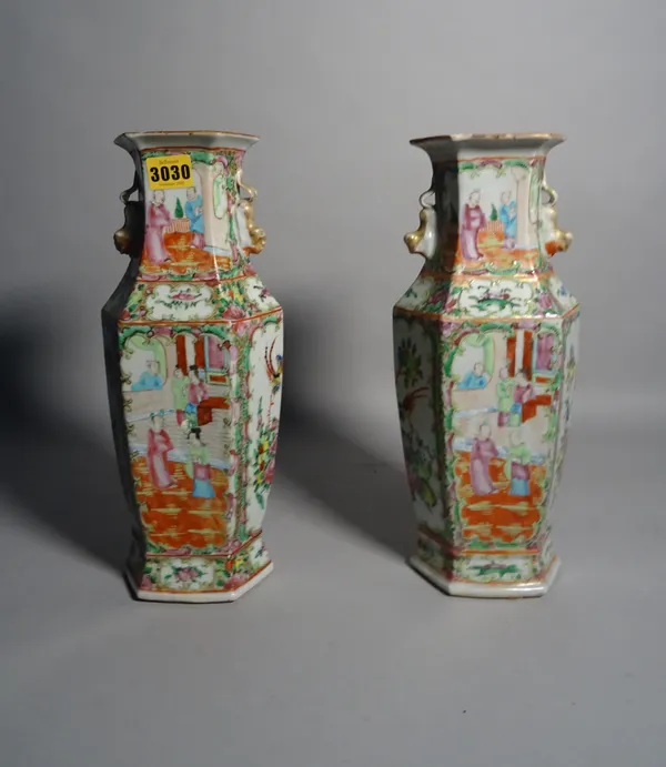 A pair of late 19th century Canton famille rose vases, 35cm high, (a.f.).