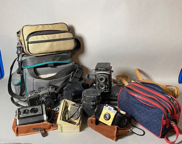 Collectables; a quantity of mid-20th century cameras and lenses, including Rolleiflex, Kodak, Minolta and others, (qty).