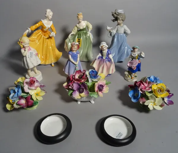 Ceramics, including; a group of three Royal Doulton ladies, a Nao figure of a lady, a Royal Worcester figure of a child and two Crown Staffordshire fl