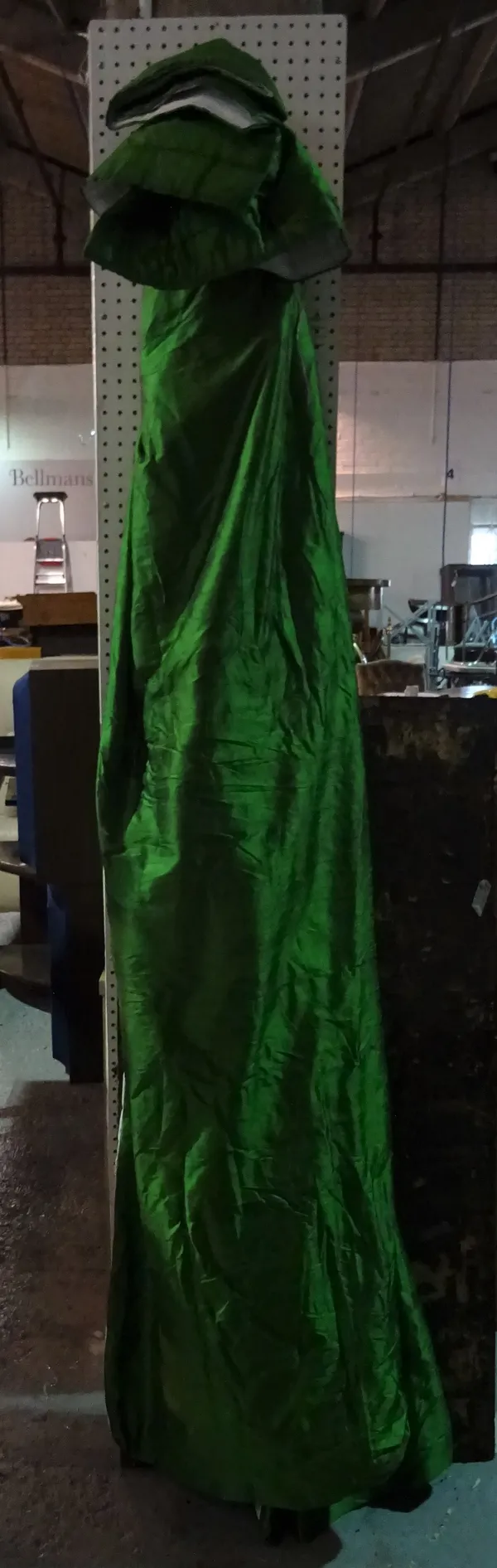 A pair of emerald green long silk curtains, each 125cm wide x 255cm long.