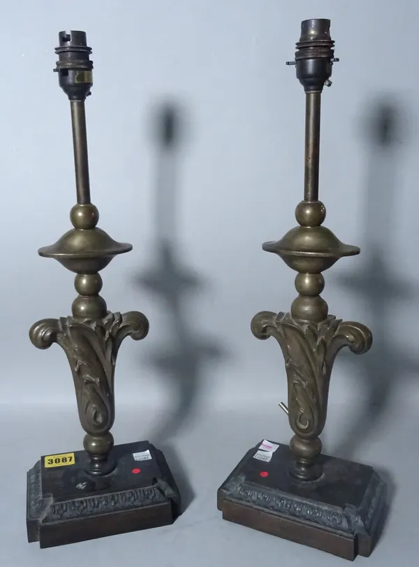 A pair of 19th century table lamps, each as an upright foliate finial, 47cm high, with a pair of shades.