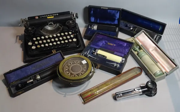 Collectables including an early 20th century portable typewriter, 30cm wide, a group of cased medical instruments, an early 20th century ships compass