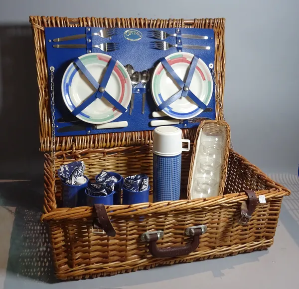 A quantity of mid-20th century Ordanance Survey maps and a wicker picnic hamper, 58cm wide x 20cm high.