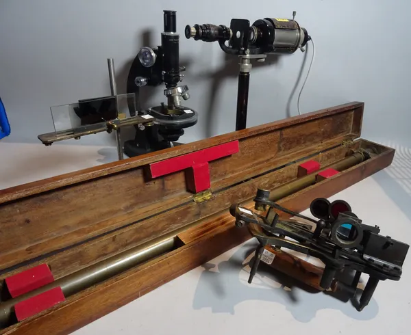 Scientific instruments including 'C. BAKER' an early 20th century microscope, 31cm wide x 32cm high, and another later microscope by 'Cooke Throughton