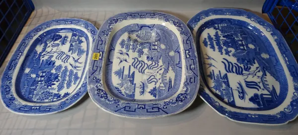 A group of three 19th century blue and white meat plates, the largest 50cm wide.