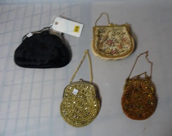 A group of four early 20th century lady's coin purses, one by 'D.H. Evans' the largest 20cm wide (4).