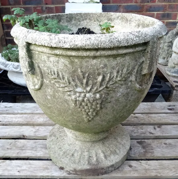 An early 20th century reconstituted stone planter with a foliate motif, 46cm wide x 50cm high.