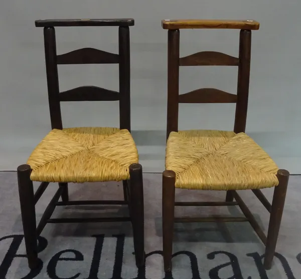 A near pair of 19th century stained pine ladderback chapel chairs, 41cm wide x 83cm high, (2).