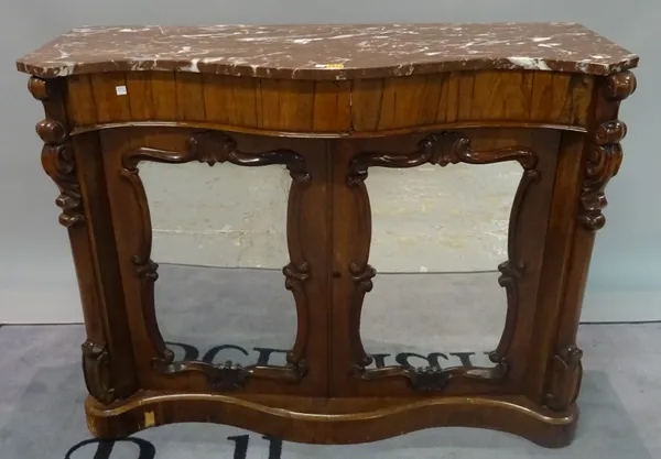 A Victorian rosewood serpentine chiffonier with marble top over mirrored doors, 121cm wide x 93cm high.