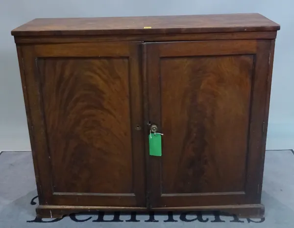 A late Victorian walnut side cupboard with panelled doors, 119cm wide x 104cm high.