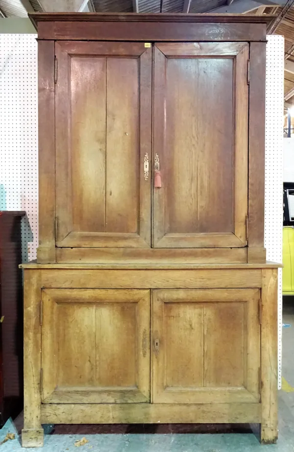 A 19th century Continental oak linen press, 145cm wide x 240cm high.