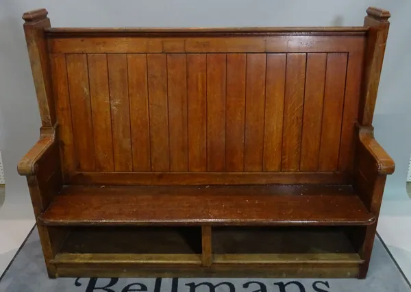 An early 20th century oak pew, 162cm wide x 128cm high.