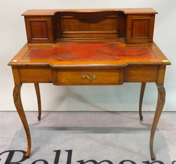 A late 19th century walnut writing desk with covered super structure over frieze drawer on cabriole supports, 91cm wide x 95cm high.