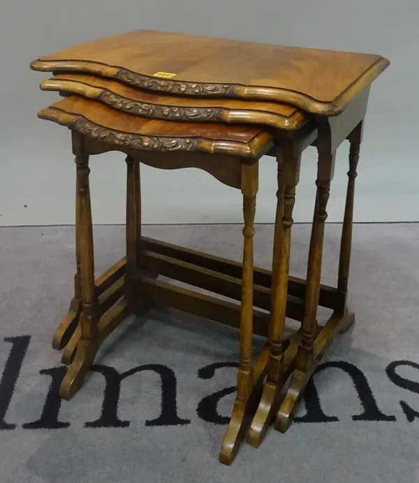 A Victorian style walnut nest of three tables, the largest 54cm wide x 57cm high.