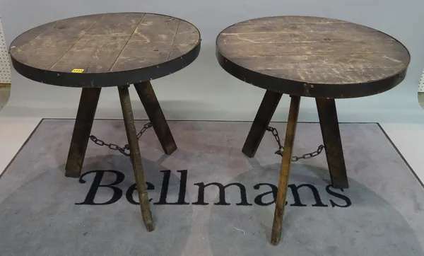 A pair of modern hardwood and metal circular occasional tables, 75cm wide x 73cm high, (2).