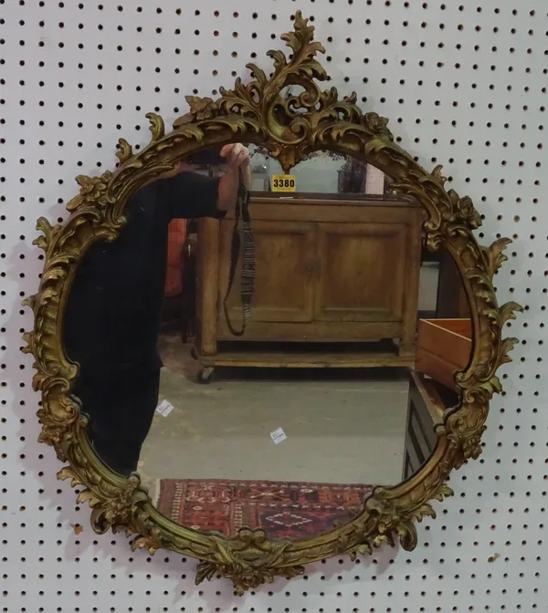 A Victorian style giltwood circular wall mirror, 67cm wide x 80cm high.