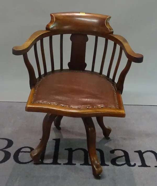 An early 20th century mahogany office open armchair, 67cm wide x 84cm high.