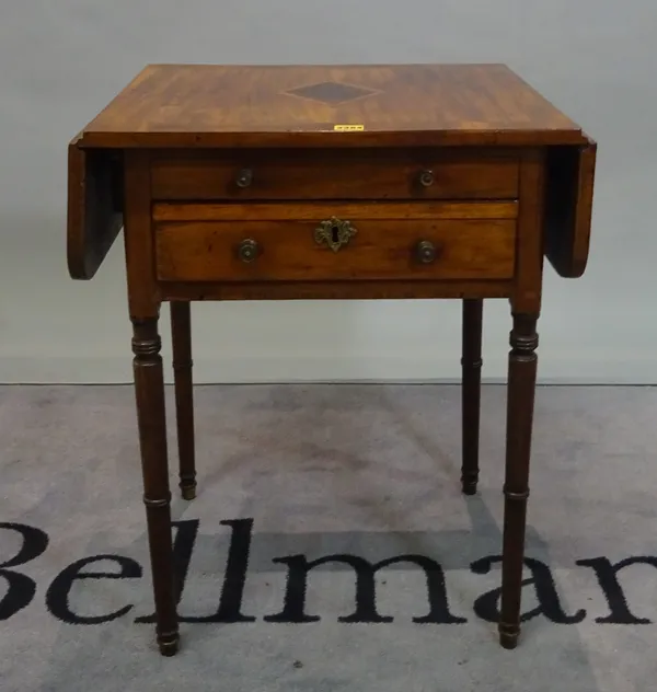 A 19th century mahogany inlaid drop flap work table on ring turned supports, 57cm wide x 70cm high.