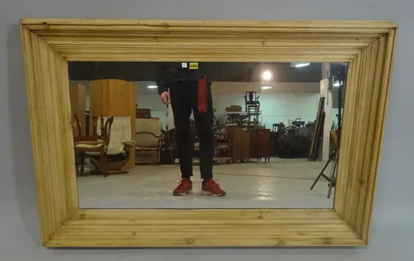 A modern pine rectangular wall mirror, 137cm wide x 91cm high.