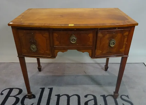 A 19th century mahogany bowfront sideboard with three frieze drawers on tapering square supports, 89cm wide x 76cm high.