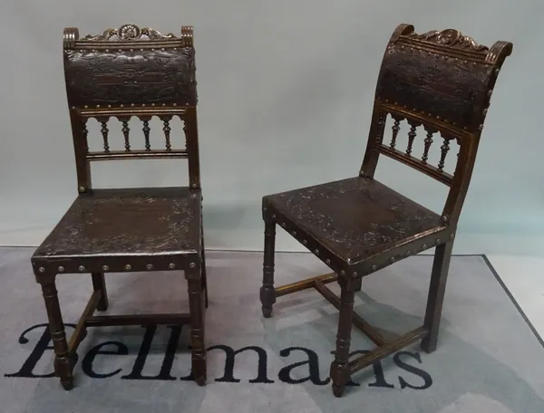 A set of six 19th century Italian oak and embossed leather dining chairs, 42cm wide x 95cm high.