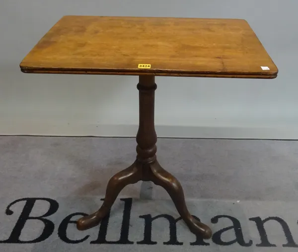 A 19th century mahogany tripod table with turned column on downswept supports, 66cm wide x 72cm high.