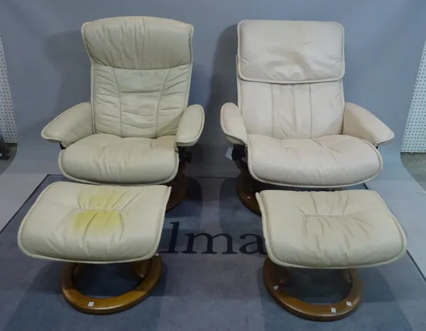 EKORNES; A pair of modern reclining armchairs with white leather upholstery on swivel circular bases, 76cm wide x 96cm high, with two matching footsto