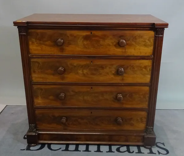 A Victorian mahogany chest of four long graduated drawers on bun feet, 110cm wide x 108cm high.