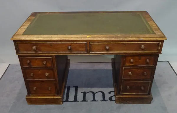 A late 19th century oak pedestal desk with inset leather top over eight drawers, 122cm wide x 77cm high.