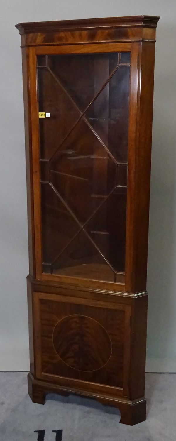 An Edwardian mahogany inlaid floor standing corner cabinet with astragal glazed door, 186cm high x 61cm wide.