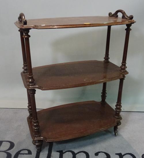 A Victorian mahogany shaped rectangular three tier what-not, 73cm wide x 98cm high.