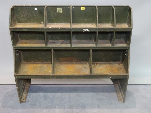 A 20th century green painted metal storage rack from a military Land Rover, 106cm wide x 92cm high.