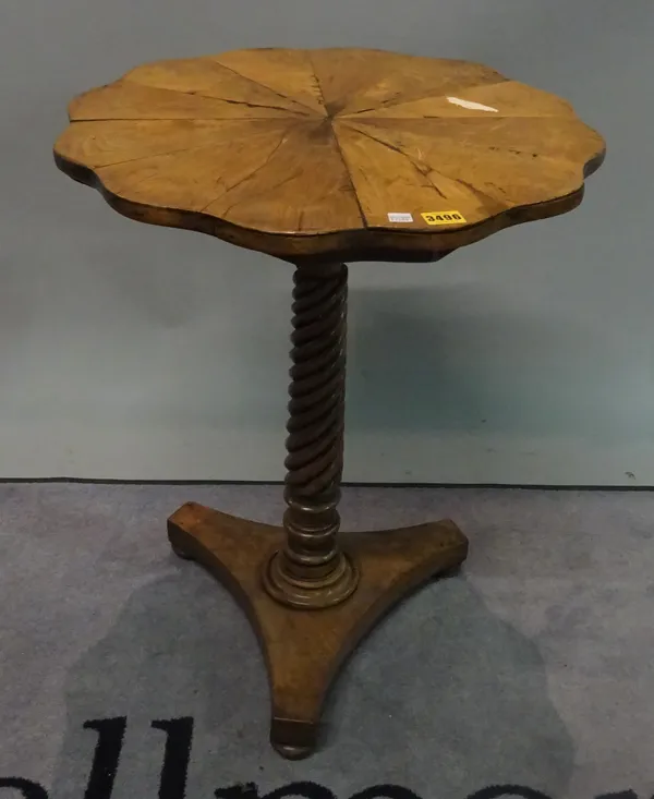 An early 19th century mahogany scallop shaped top occasional table on spiral twisted column on the trefoil base, 53cm wide x 71cm high..