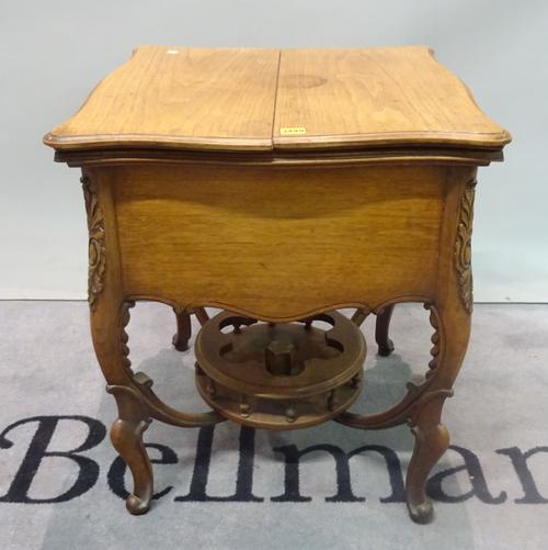 A late Victorian mahogany lift top drinks table with fitted interior on cabriole supports, 60cm wide x 72cm high.