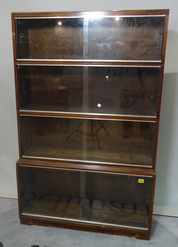 A 20th century four section walnut Minty modular bookcase, 86cm wide.
